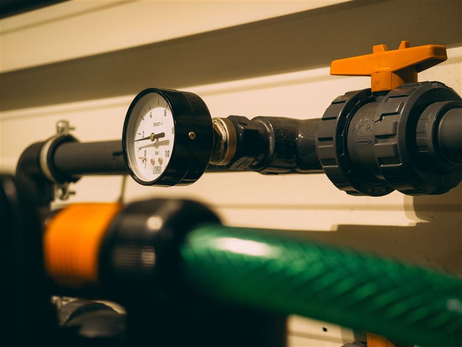 Pressure gauge and valve on circulation pipework